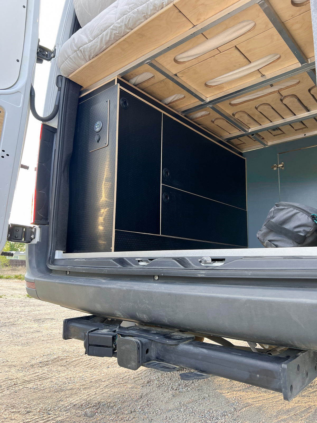Garage storage under the Mars bed, reached from the rear doors