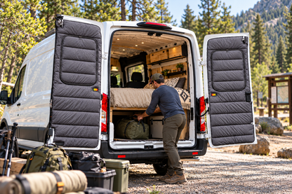 Maxx Cover Pro insulated rear door covers for the Ford Transit Mid Roof, while packing gear at the rear doors
